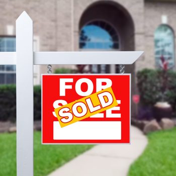 Sold Home For Sale Sign in Front of New House